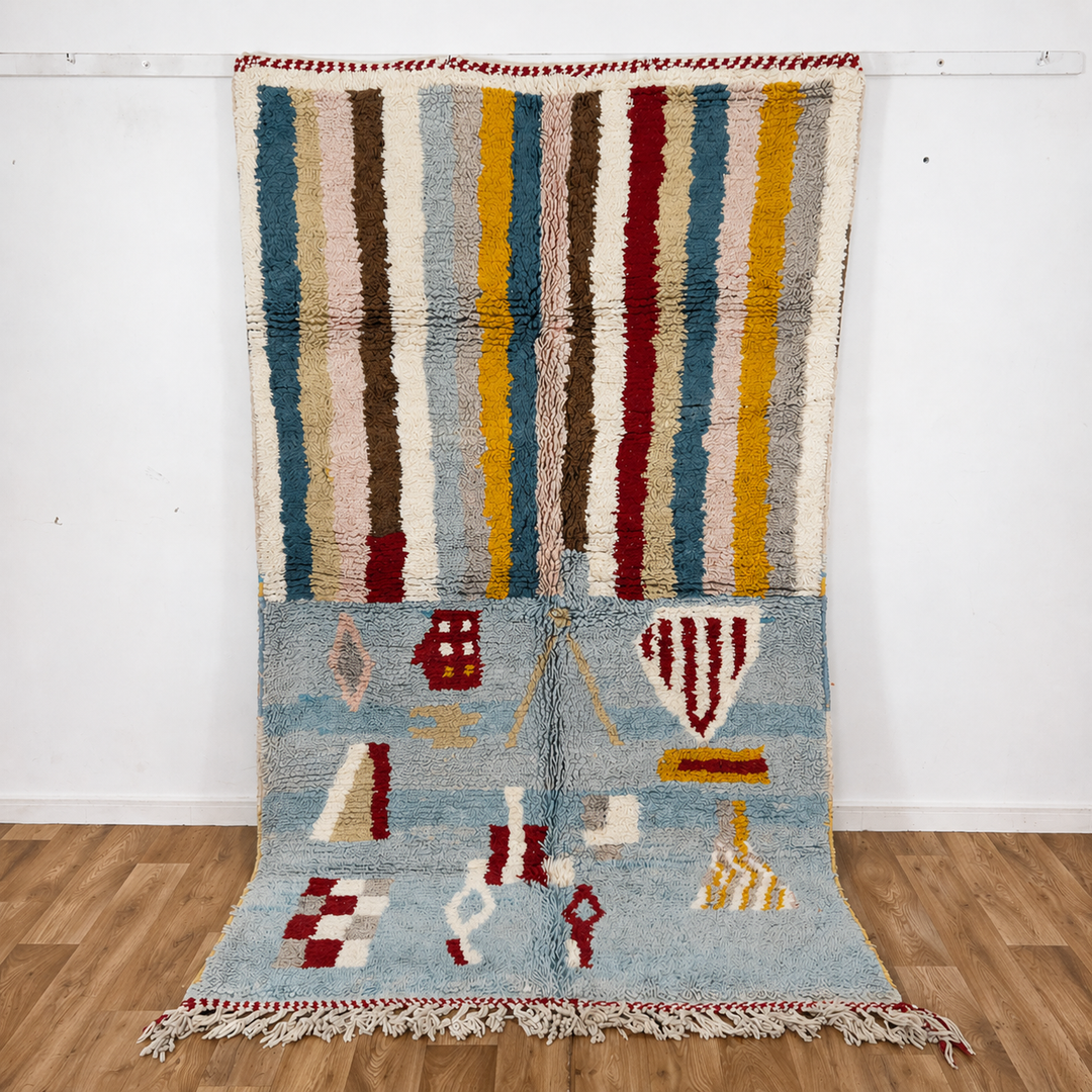 Vintage Moroccan wool rug with striped and tribal patterns in blue, cream, and red tones, handmade Berber carpet 8x5 ft