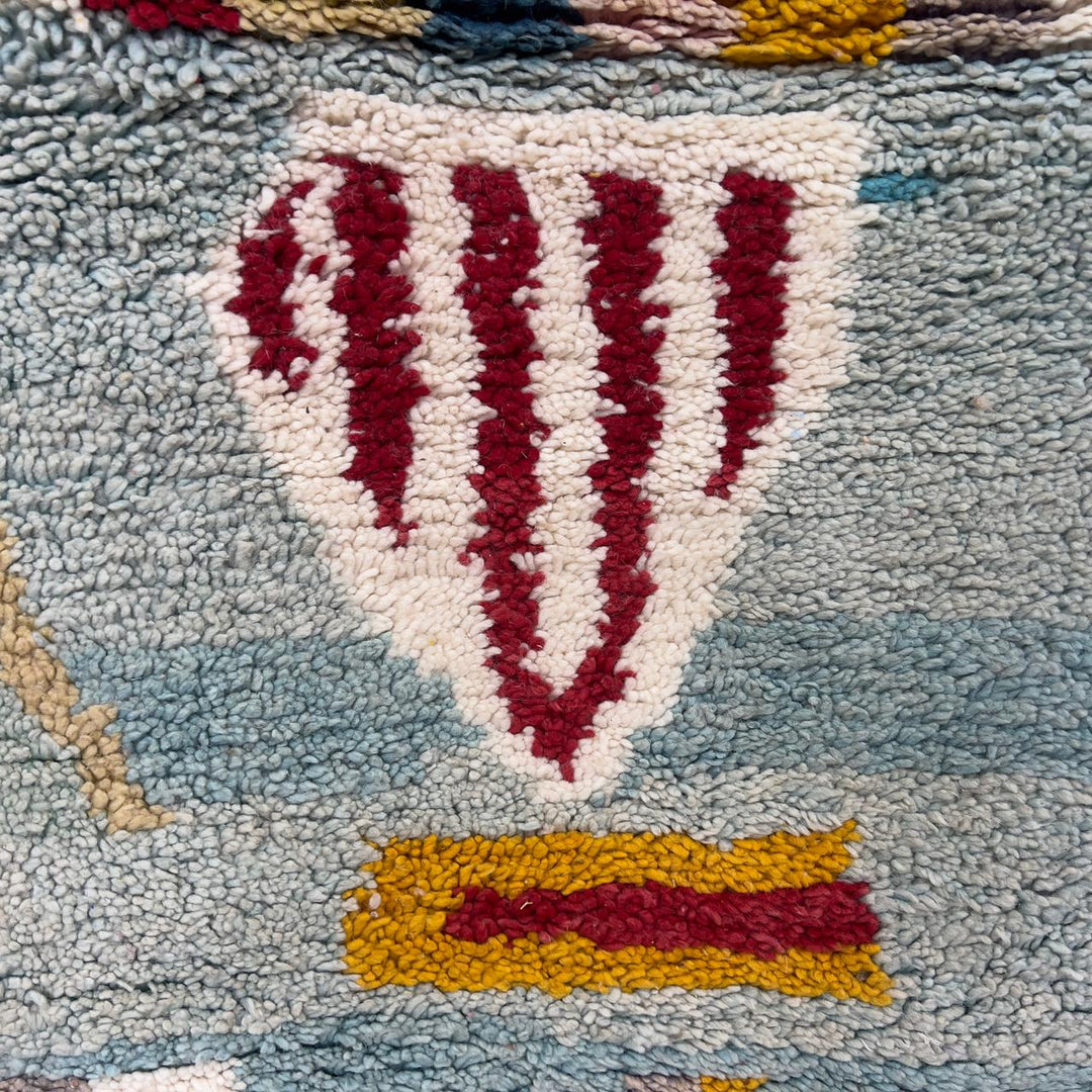 Vintage Moroccan wool rug with striped and tribal patterns in blue, cream, and red tones, handmade Berber carpet 8x5 ft