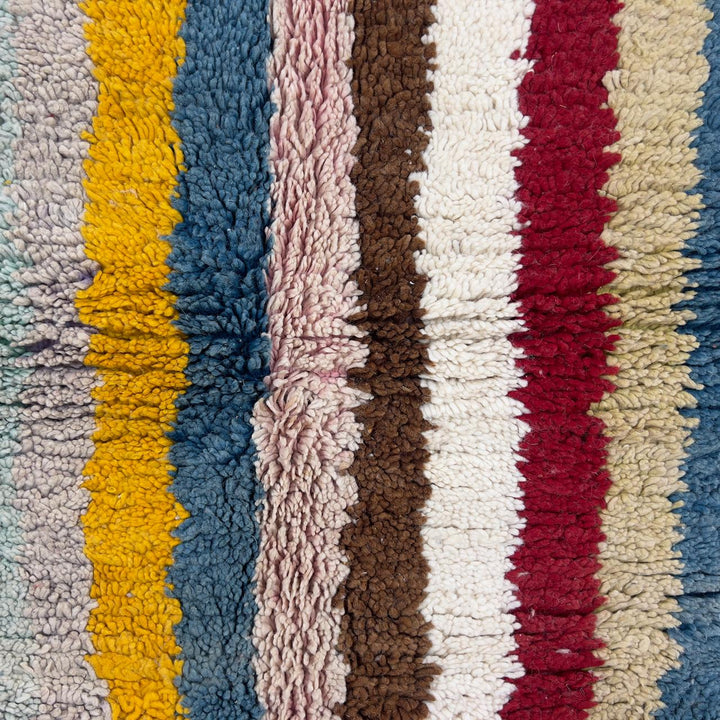 Vintage Moroccan wool rug with striped and tribal patterns in blue, cream, and red tones, handmade Berber carpet 8x5 ft