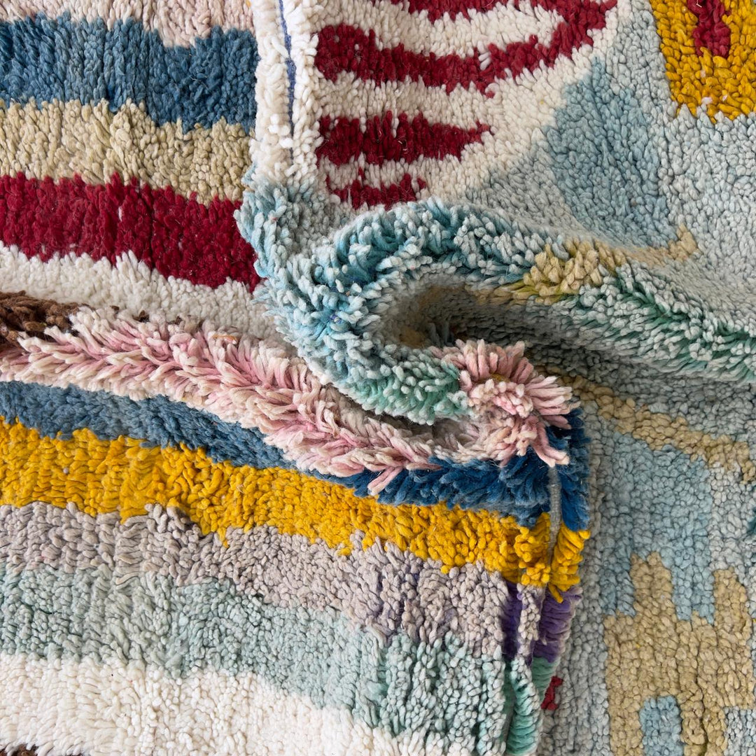 Vintage Moroccan wool rug with striped and tribal patterns in blue, cream, and red tones, handmade Berber carpet 8x5 ft