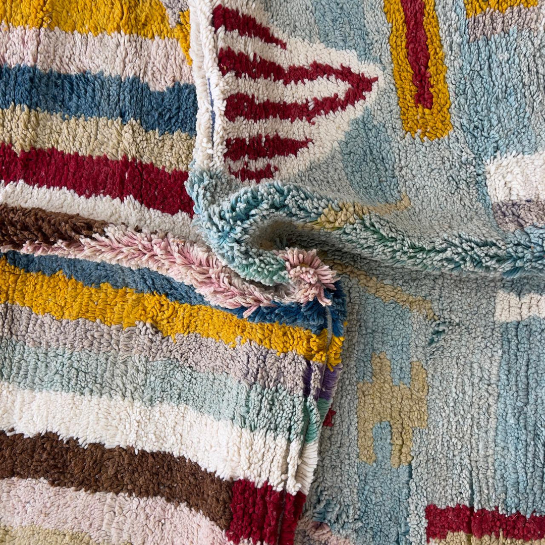 Vintage Moroccan wool rug with striped and tribal patterns in blue, cream, and red tones, handmade Berber carpet 8x5 ft