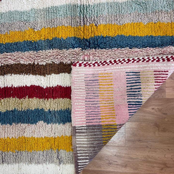 Vintage Moroccan wool rug with striped and tribal patterns in blue, cream, and red tones, handmade Berber carpet 8x5 ft