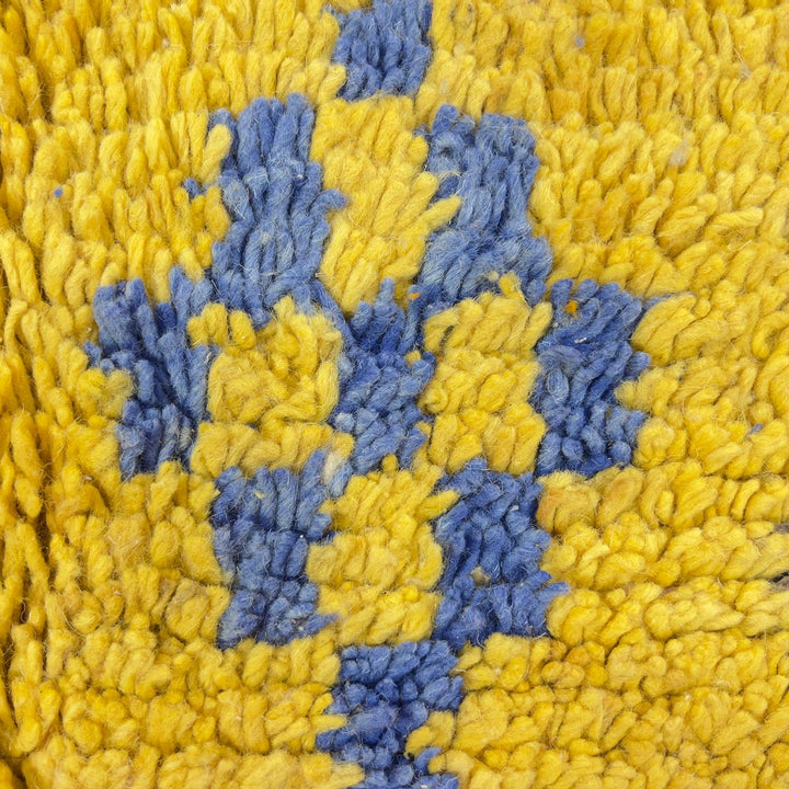 Vintage Moroccan wool rug with colorful geometric design in yellow, pink, blue, and ivory tones