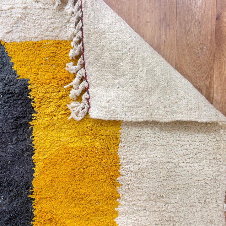Vintage Moroccan wool rug minimalist ivory with red black yellow stripes