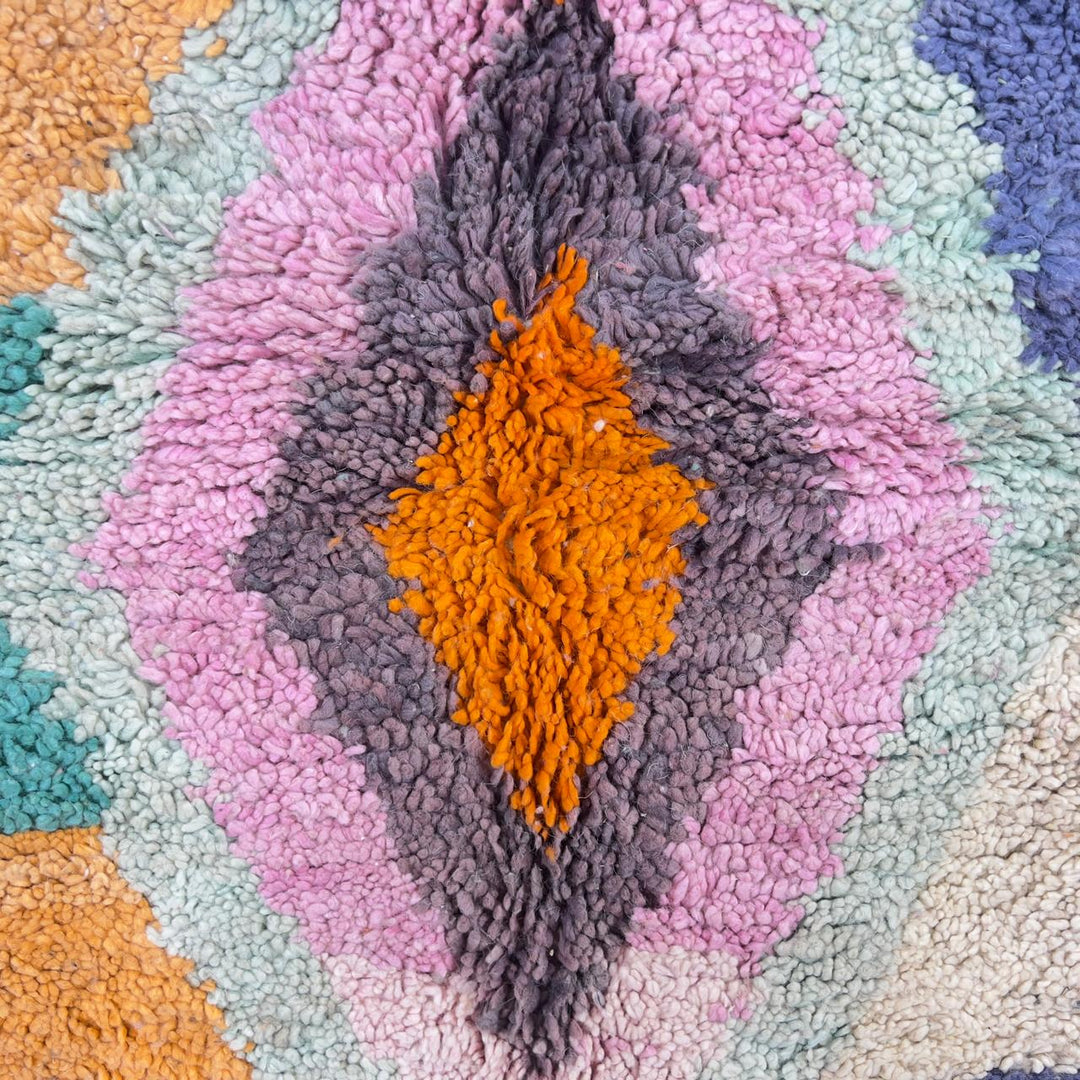 Vintage Moroccan wool rug with pastel geometric blocks and central diamond motif handmade Berber rug