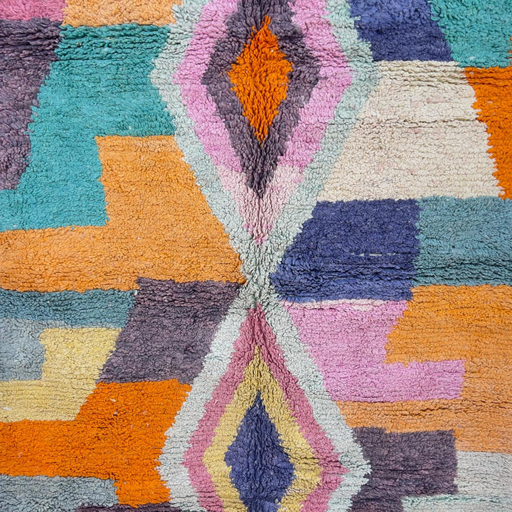 Vintage Moroccan wool rug with pastel geometric blocks and central diamond motif handmade Berber rug