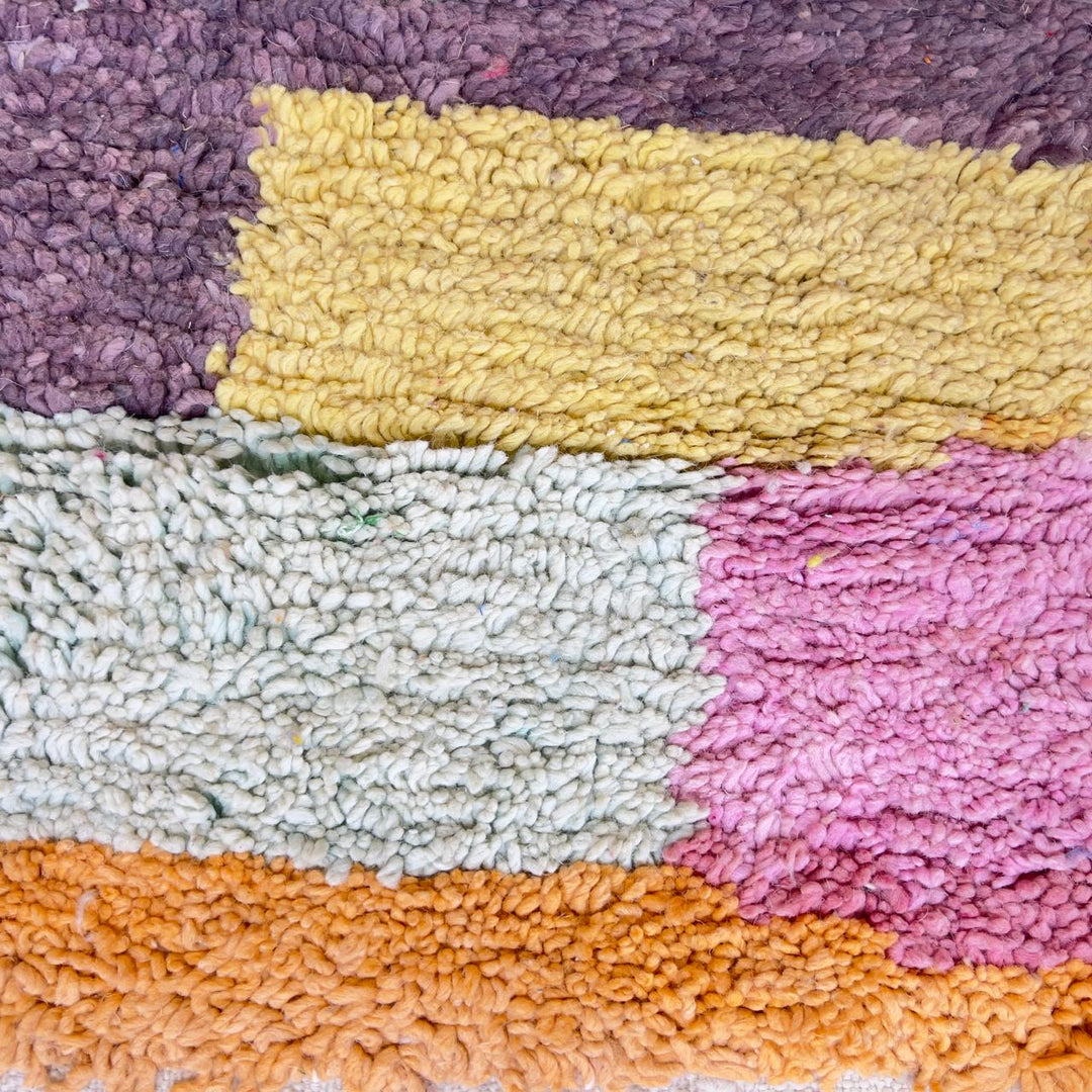 Vintage Moroccan wool rug with pastel geometric blocks and central diamond motif handmade Berber rug