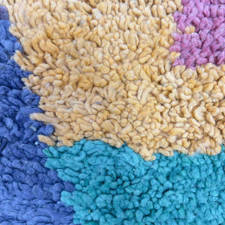 Vintage Moroccan wool rug with pastel geometric blocks and central diamond motif handmade Berber rug