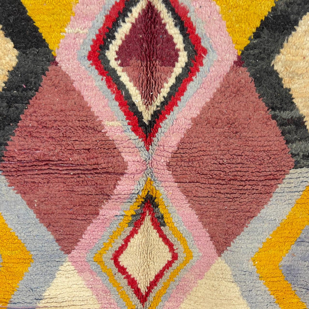 Vintage Moroccan wool rug with diamond geometric pattern in yellow, pink and burgundy tones handmade Berber rug