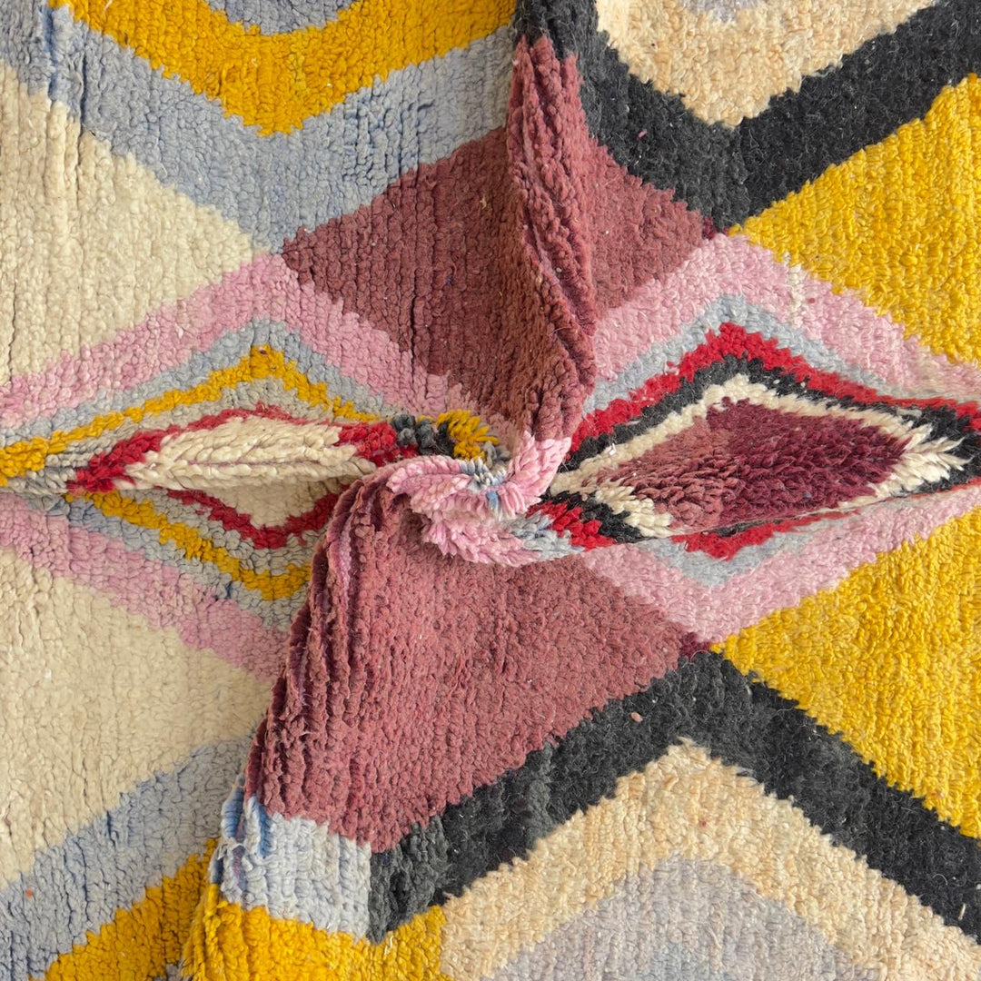 Vintage Moroccan wool rug with diamond geometric pattern in yellow, pink and burgundy tones handmade Berber rug