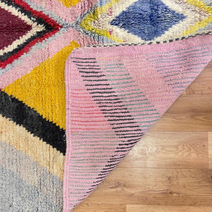 Vintage Moroccan wool rug with diamond geometric pattern in yellow, pink and burgundy tones handmade Berber rug
