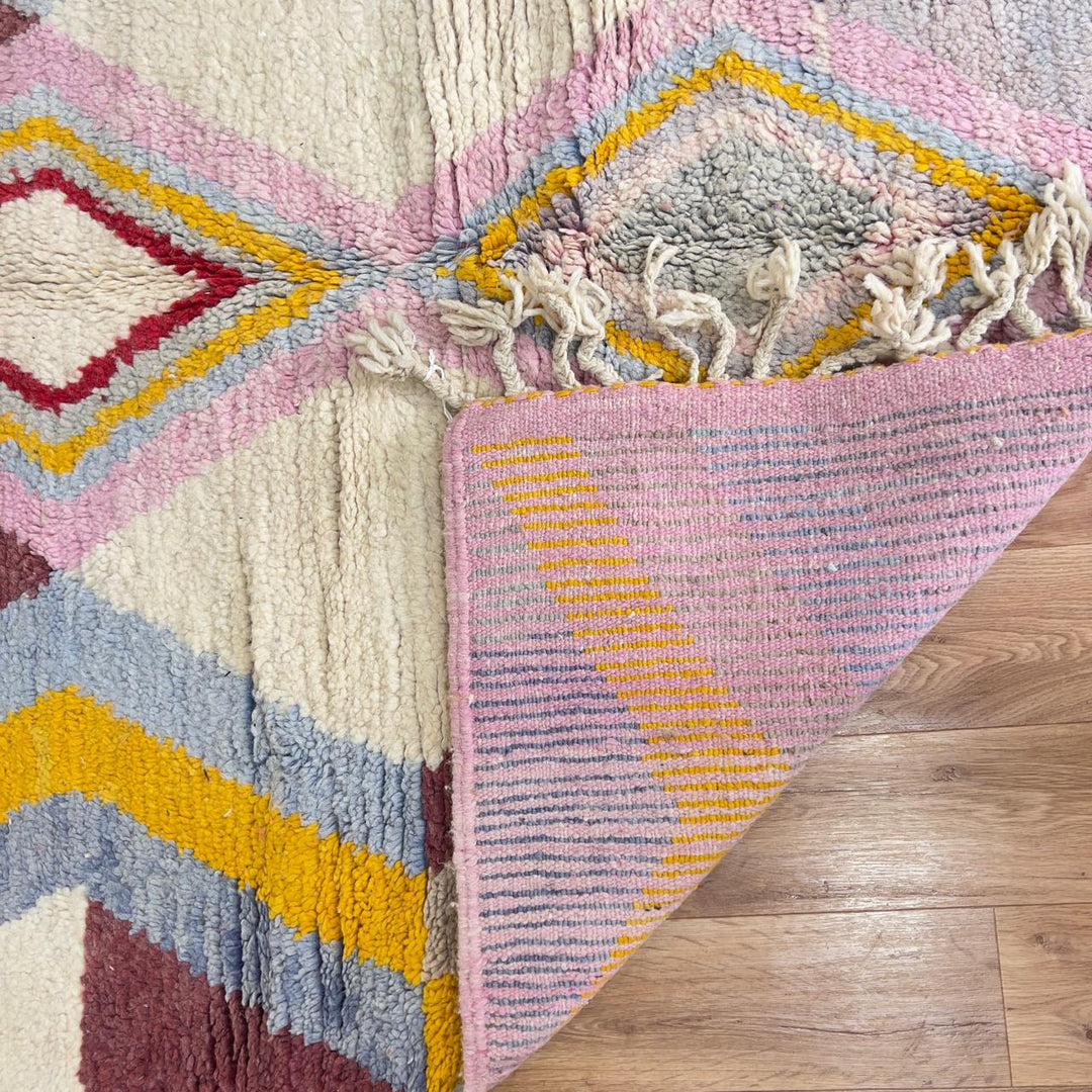 Vintage Moroccan wool rug with diamond geometric pattern in yellow, pink and burgundy tones handmade Berber rug