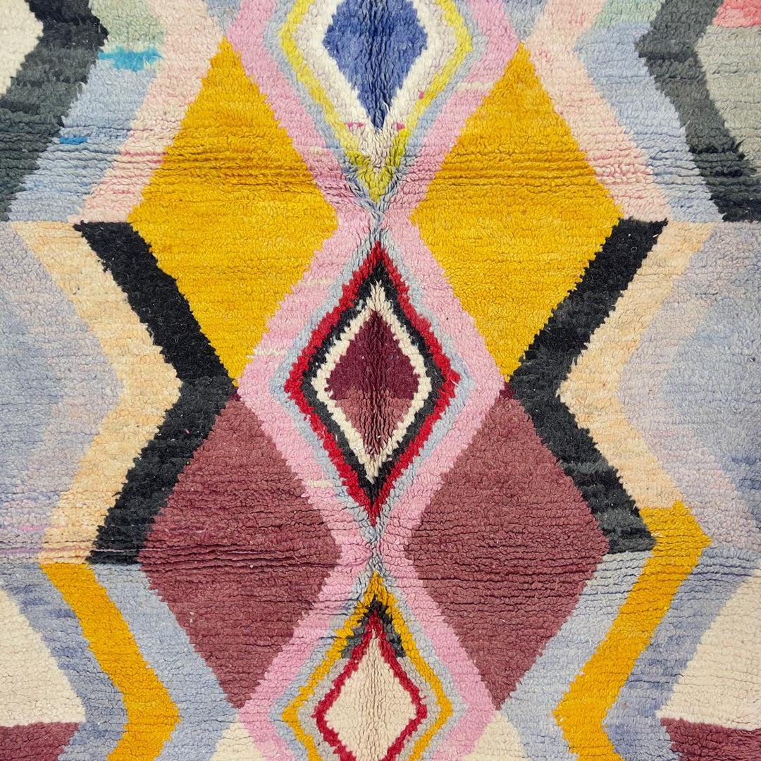 Vintage Moroccan wool rug with diamond geometric pattern in yellow, pink and burgundy tones handmade Berber rug