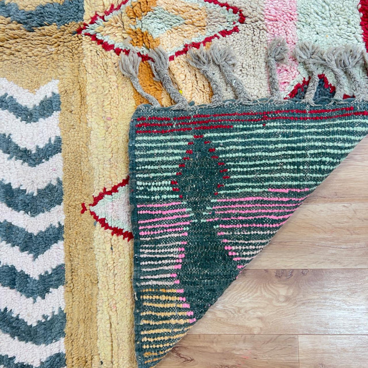 Vintage Moroccan wool rug with pink and mustard tribal horizontal patterns handmade Berber rug