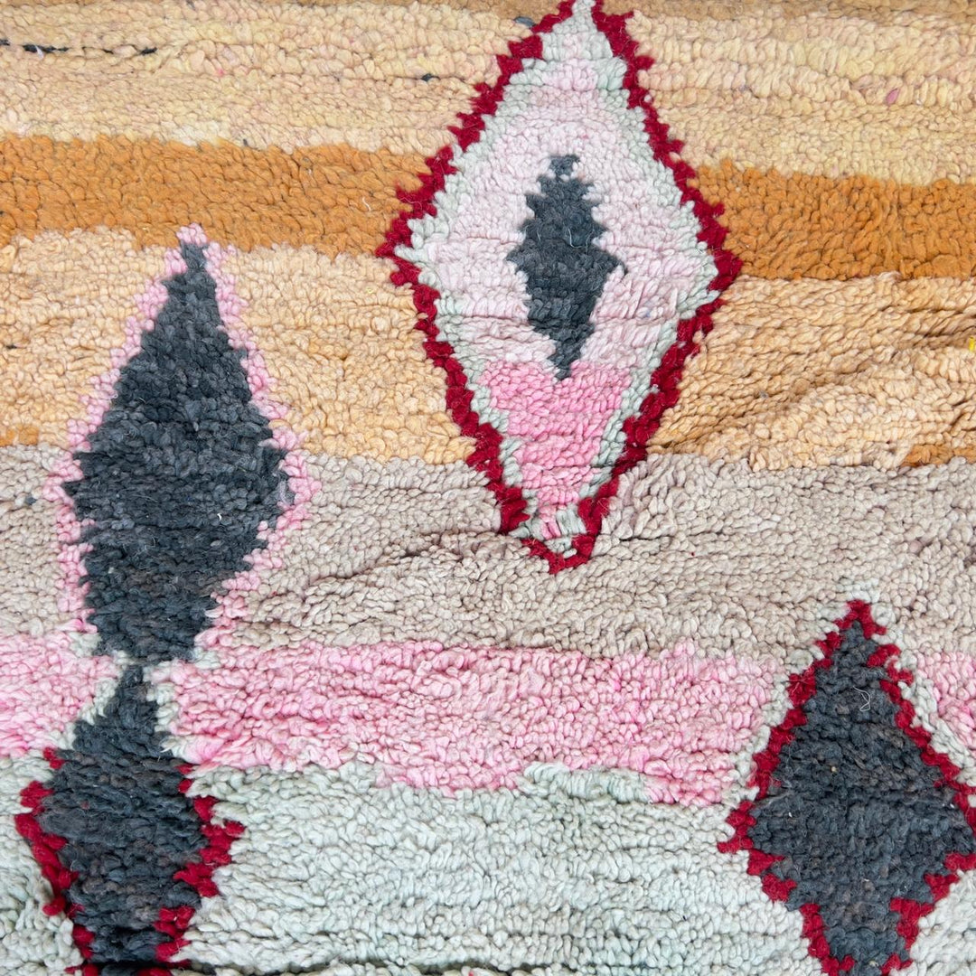 Vintage Moroccan wool rug with pink and mustard tribal horizontal patterns handmade Berber rug