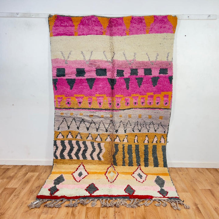 Vintage Moroccan wool rug with pink and mustard tribal horizontal patterns handmade Berber rug