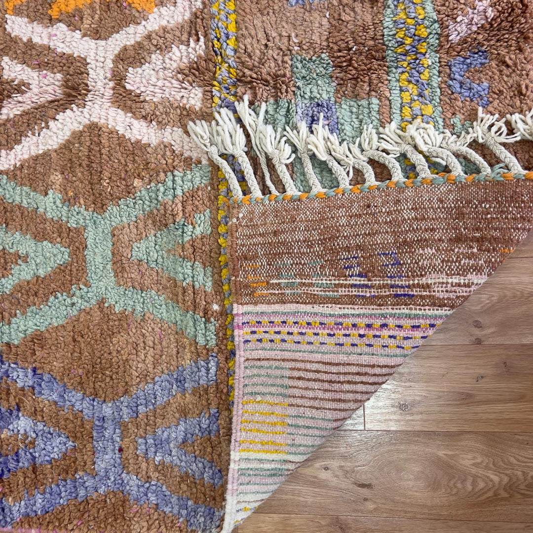 Vintage Moroccan wool rug with colorful Berber geometric patterns on brown background, handmade tribal carpet 8x5 ft