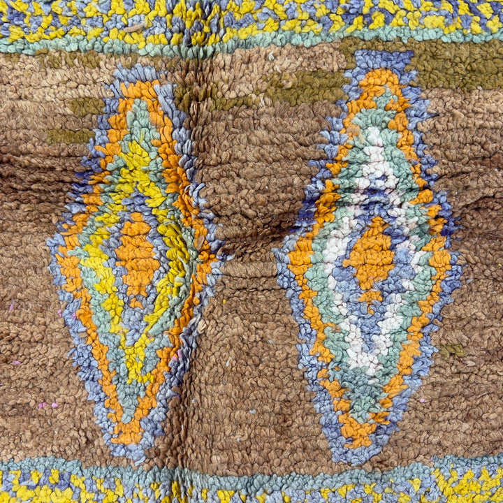 Vintage Moroccan wool rug with colorful Berber geometric patterns on brown background, handmade tribal carpet 8x5 ft