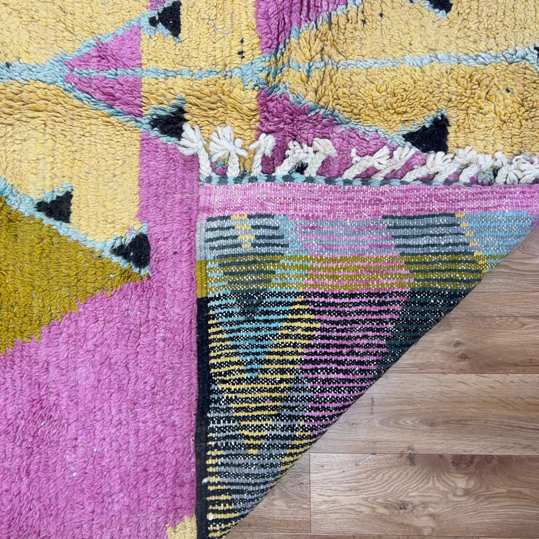 Vintage Moroccan wool rug in vibrant pink with geometric Berber patterns in mustard, beige, and charcoal, handmade shag rug