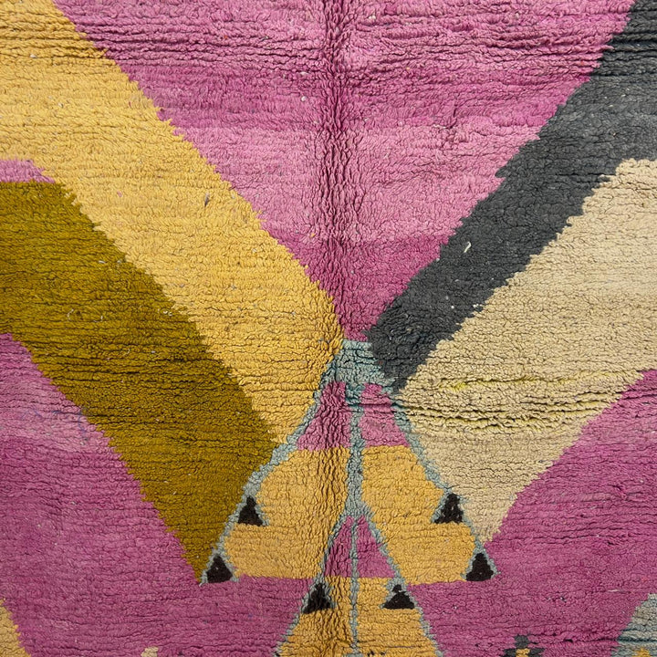 Vintage Moroccan wool rug in vibrant pink with geometric Berber patterns in mustard, beige, and charcoal, handmade shag rug