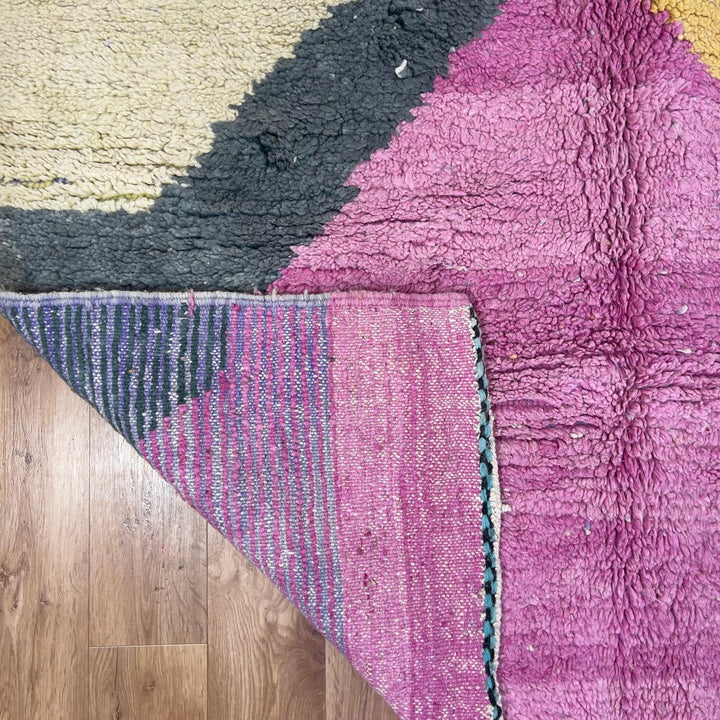 Vintage Moroccan wool rug in vibrant pink with geometric Berber patterns in mustard, beige, and charcoal, handmade shag rug