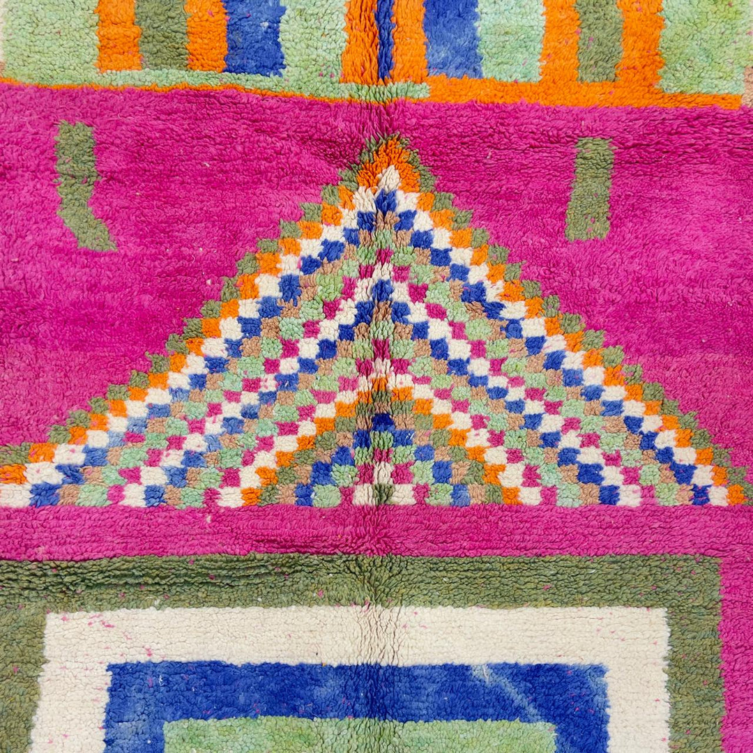 Vintage Moroccan wool rug with pink base and colorful geometric tribal patterns