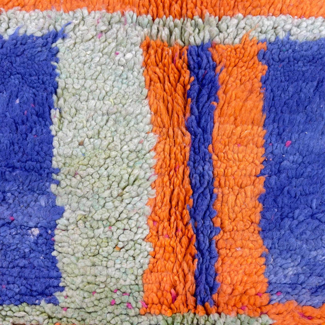 Vintage Moroccan wool rug with pink base and colorful geometric tribal patterns