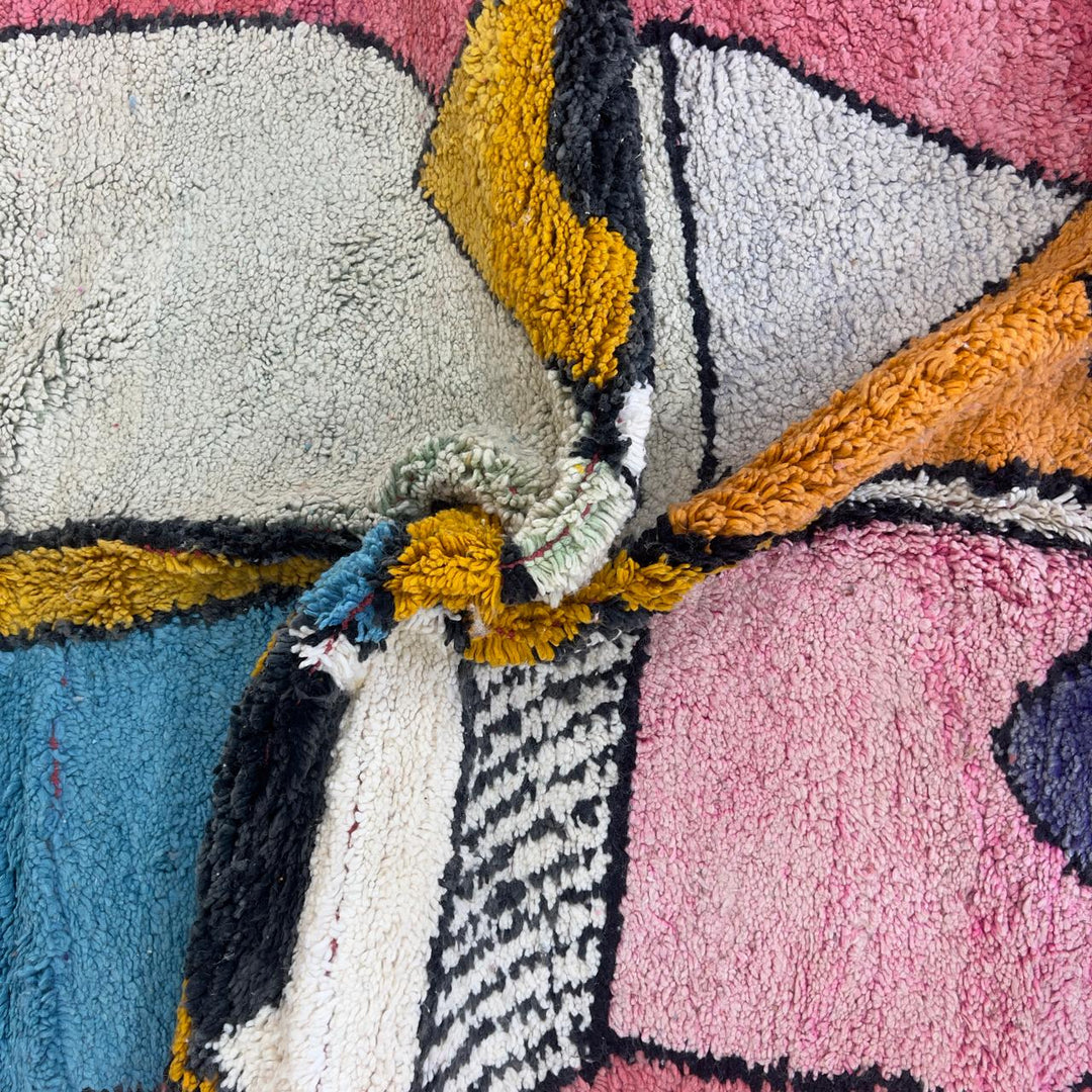 Vintage Moroccan wool rug 8.5 x 5.1 ft with abstract human figures design in pink blue and cream handmade Berber rug