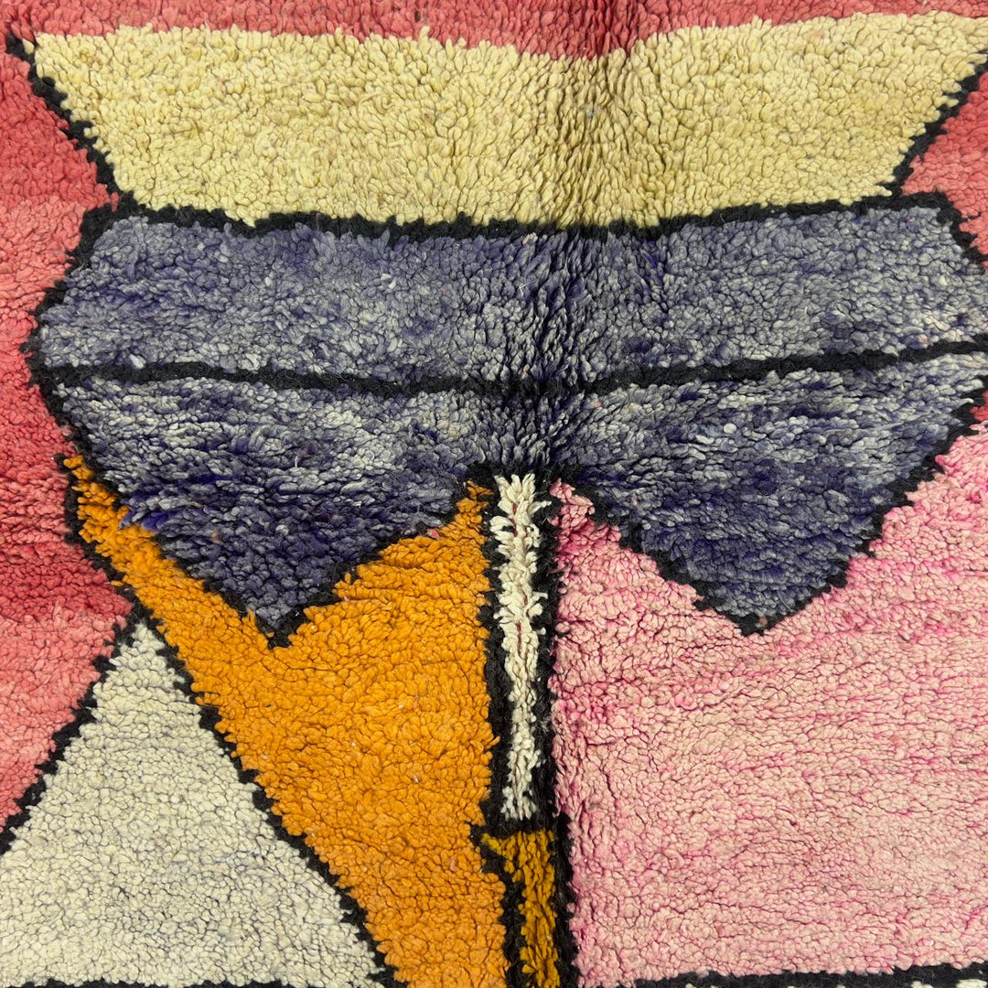 Vintage Moroccan wool rug 8.5 x 5.1 ft with abstract human figures design in pink blue and cream handmade Berber rug