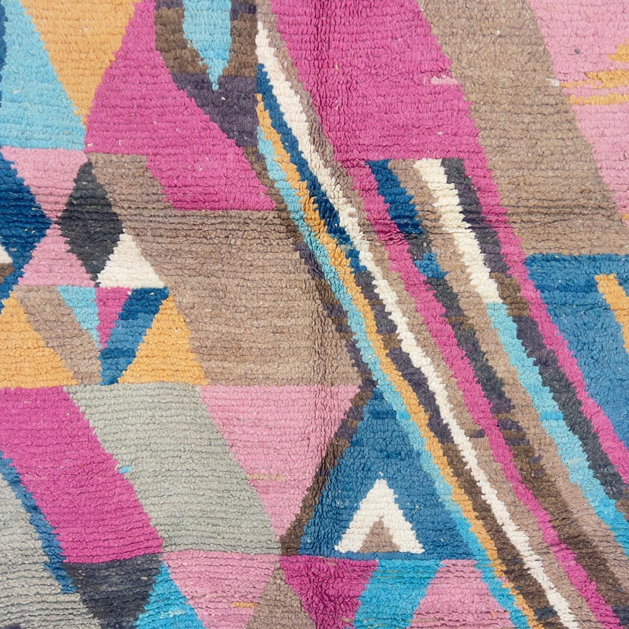 Vintage Moroccan wool rug with geometric abstract pattern in blue, pink and neutral tones, handmade Berber rug