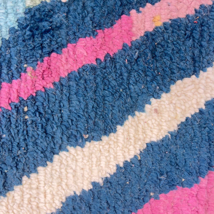 Vintage Moroccan wool rug with geometric abstract pattern in blue, pink and neutral tones, handmade Berber rug