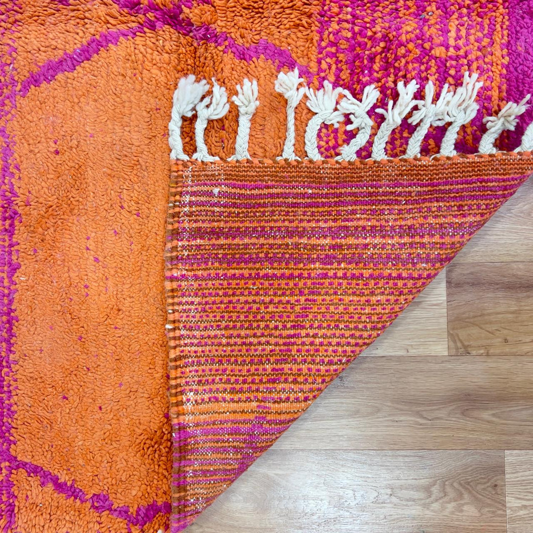 Vintage Moroccan wool rug in orange and magenta with geometric tribal pattern handmade Berber rug