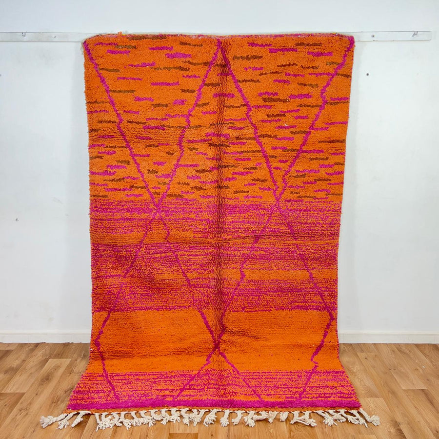 Vintage Moroccan wool rug in orange and magenta with geometric tribal pattern handmade Berber rug