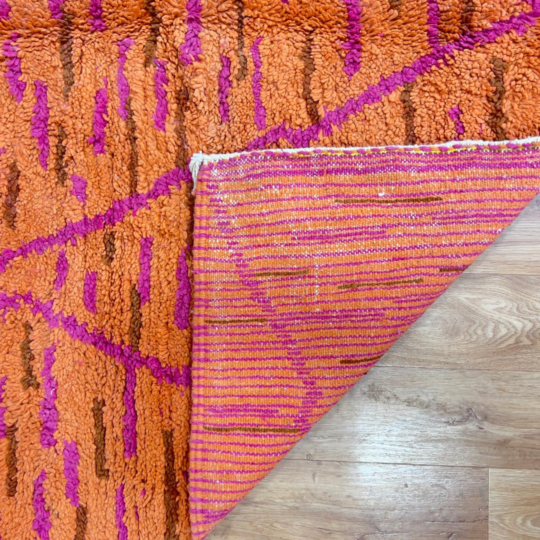Vintage Moroccan wool rug in orange and magenta with geometric tribal pattern handmade Berber rug