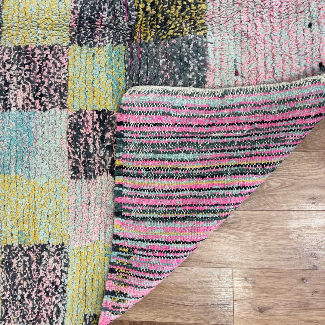 Vintage Moroccan wool rug 8.0 x 5.3 ft with pastel checkered pattern and zigzag design in pink teal and yellow handmade Berber rug