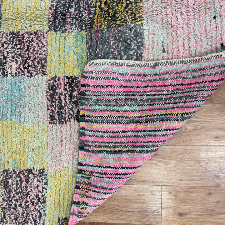 Vintage Moroccan wool rug 8.0 x 5.3 ft with pastel checkered pattern and zigzag design in pink teal and yellow handmade Berber rug