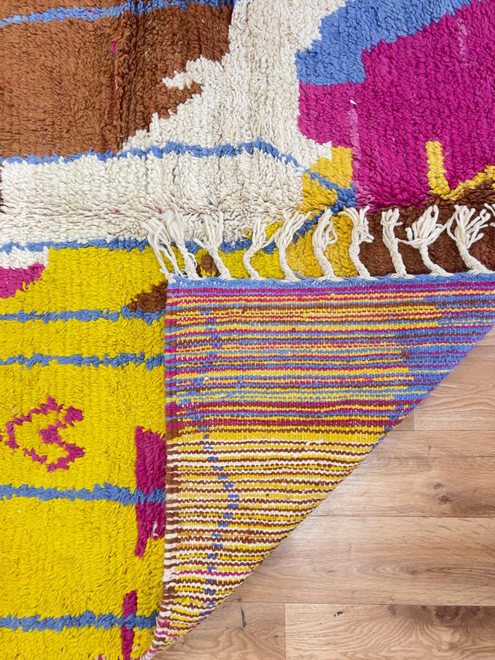 Vintage Moroccan wool rug with colorful patchwork geometric design in pink, blue, yellow and green tones, handmade Berber rug 8x5 ft