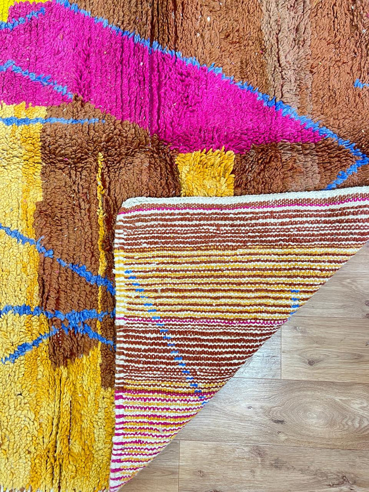 Vintage Moroccan wool rug with colorful patchwork geometric design in pink, blue, yellow and green tones, handmade Berber rug 8x5 ft