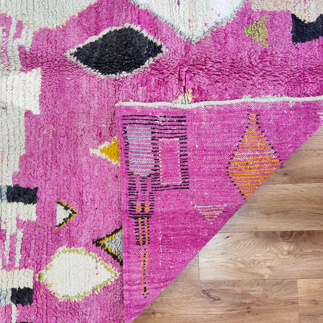 Vintage Moroccan wool rug in pink with abstract geometric Berber patterns, handmade wool rug