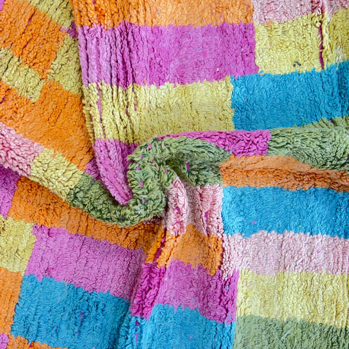 Vintage Moroccan wool rug with colorful patchwork geometric design in pink, blue, yellow and green tones, handmade Berber rug 8x5 ft