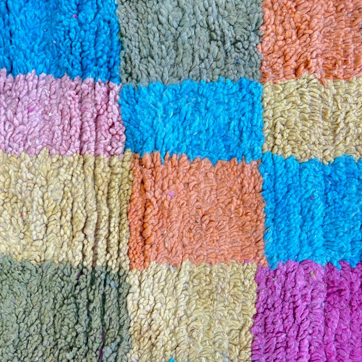 Vintage Moroccan wool rug with colorful patchwork geometric design in pink, blue, yellow and green tones, handmade Berber rug 8x5 ft