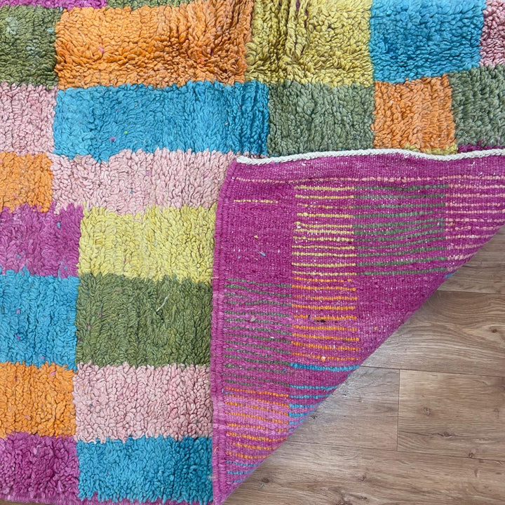 Vintage Moroccan wool rug with colorful patchwork geometric design in pink, blue, yellow and green tones, handmade Berber rug 8x5 ft