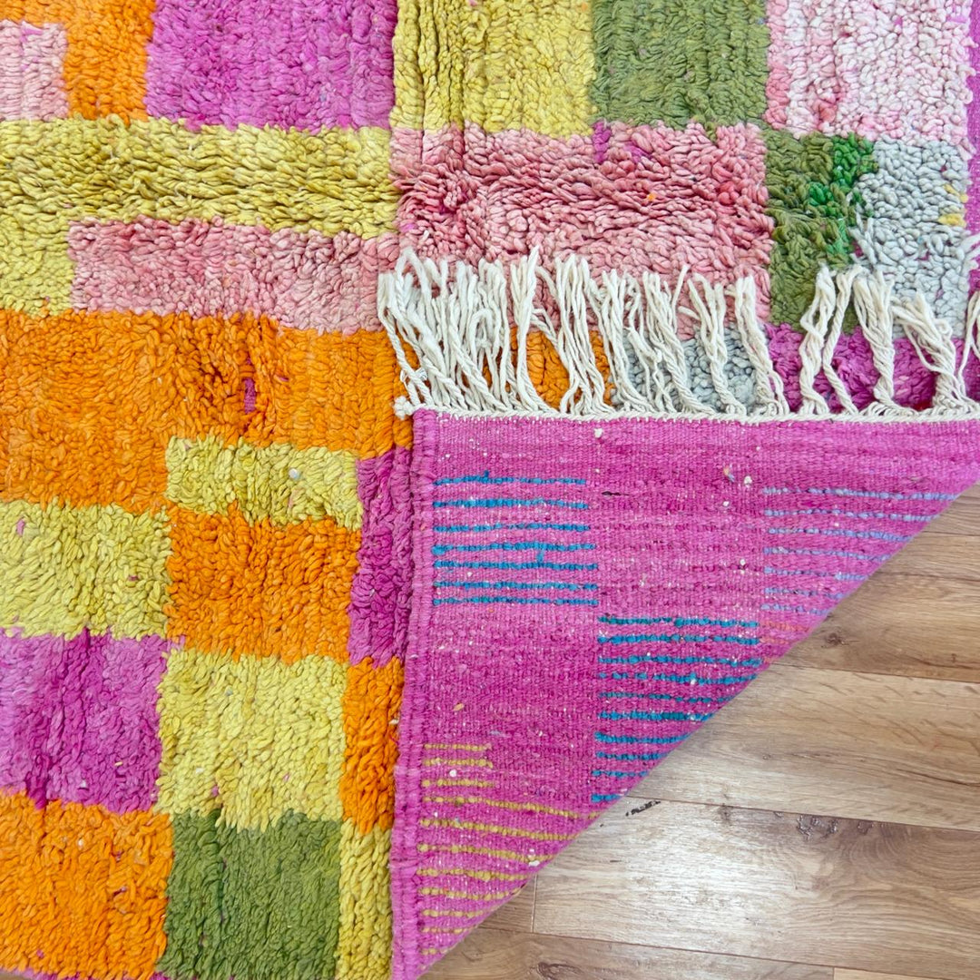 Vintage Moroccan wool rug with colorful patchwork geometric design in pink, blue, yellow and green tones, handmade Berber rug 8x5 ft