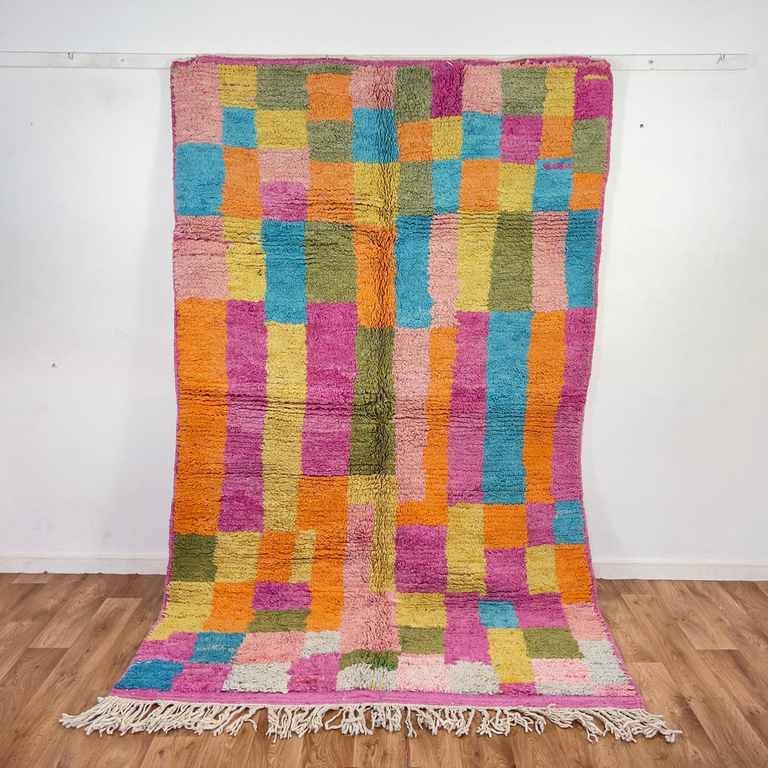 Vintage Moroccan wool rug with colorful patchwork geometric design in pink, blue, yellow and green tones, handmade Berber rug 8x5 ft