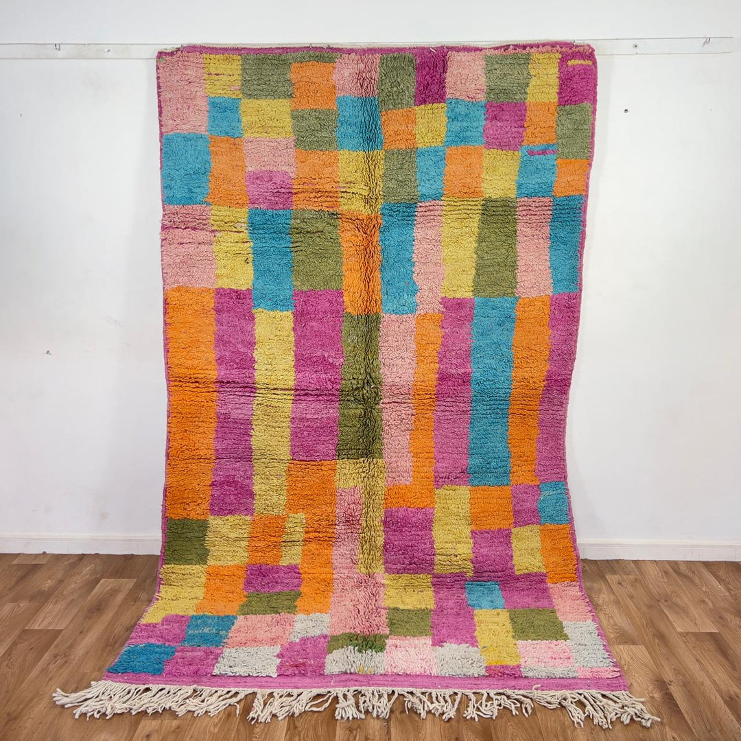 Vintage Moroccan wool rug with colorful patchwork geometric design in pink, blue, yellow and green tones, handmade Berber rug 8x5 ft