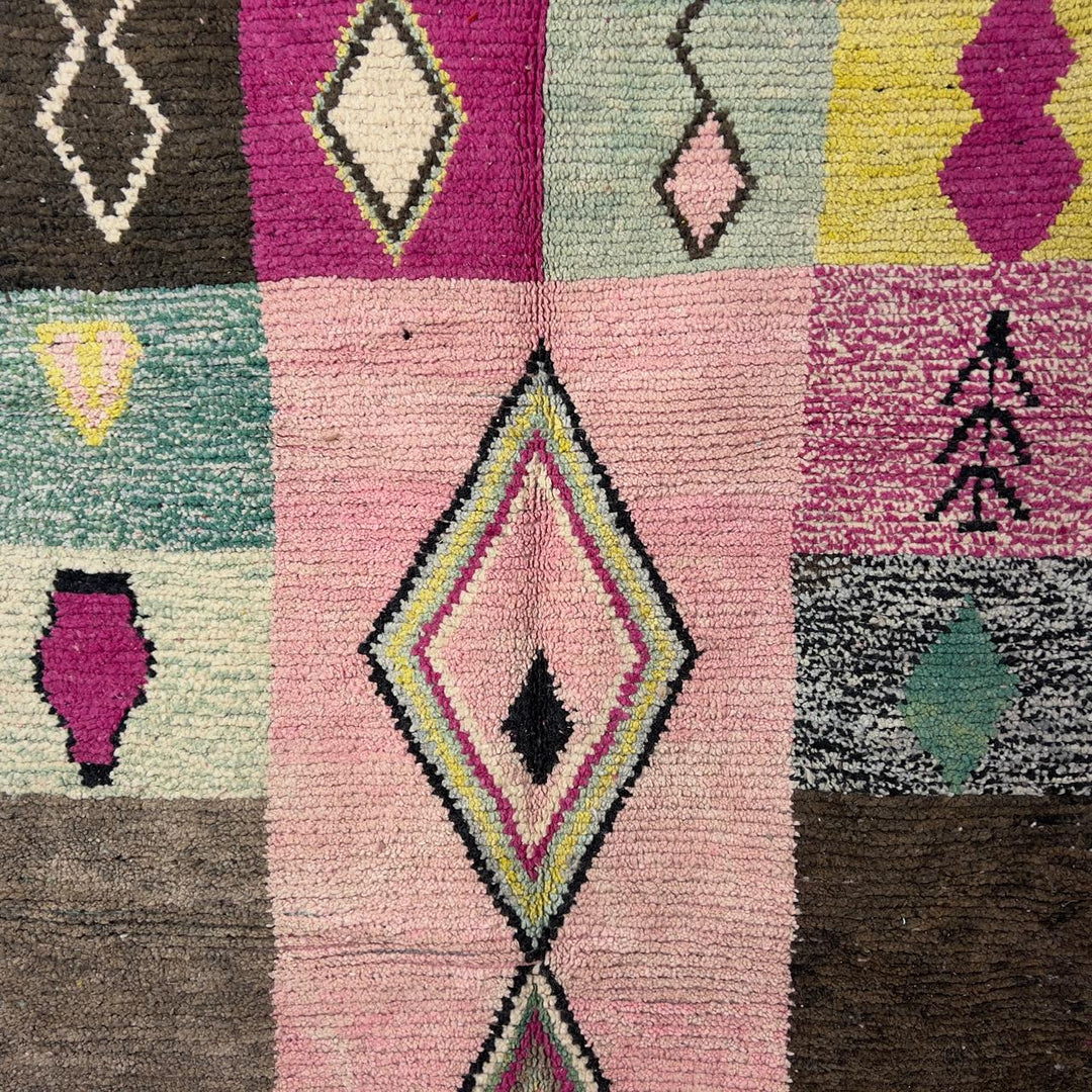 Vintage Moroccan wool rug 8.20 x 5.12 ft Rug 46 featuring central diamond motif with pastel patchwork design in pink, green, cream, and brown tones