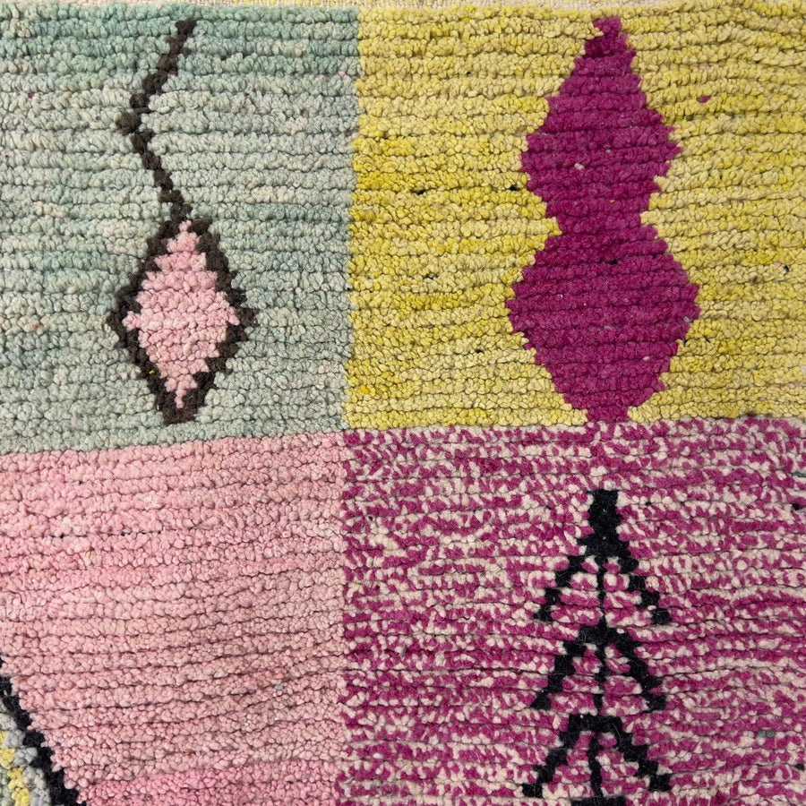 Vintage Moroccan wool rug 8.20 x 5.12 ft Rug 46 featuring central diamond motif with pastel patchwork design in pink, green, cream, and brown tones