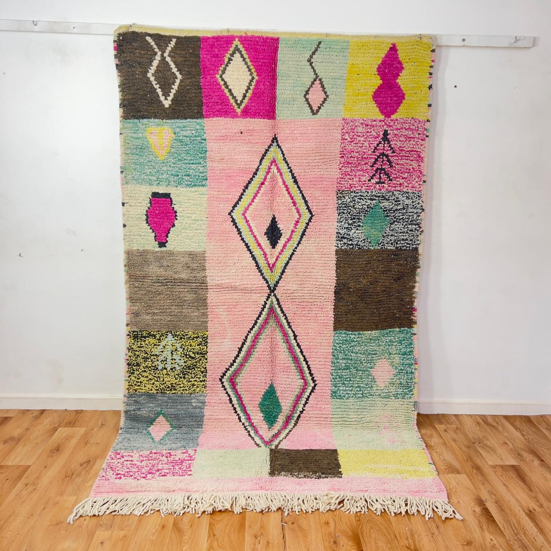 Vintage Moroccan wool rug 8.20 x 5.12 ft Rug 46 featuring central diamond motif with pastel patchwork design in pink, green, cream, and brown tones