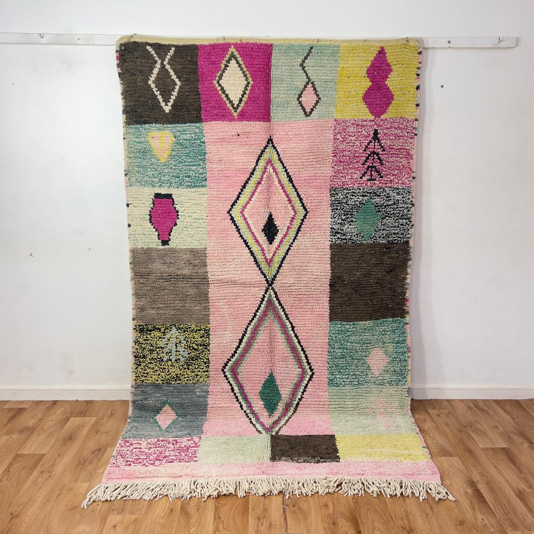 Vintage Moroccan wool rug 8.20 x 5.12 ft Rug 46 featuring central diamond motif with pastel patchwork design in pink, green, cream, and brown tones