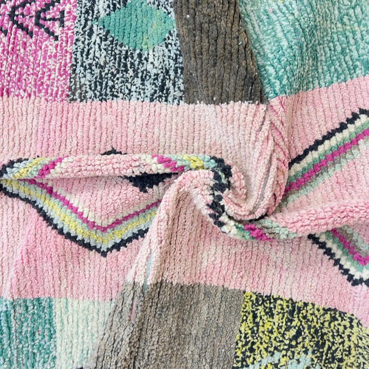 Vintage Moroccan wool rug 8.20 x 5.12 ft Rug 46 featuring central diamond motif with pastel patchwork design in pink, green, cream, and brown tones